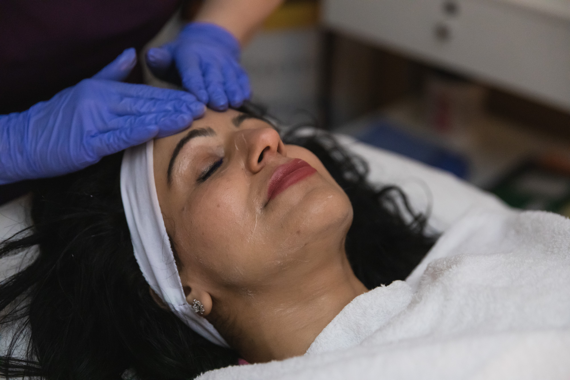 A woman receives a custom facial in Sterling Heights, MI