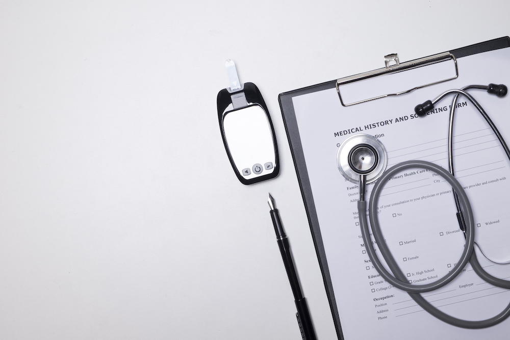 stethoscope and paper on a desk for a geriatric assessment near you