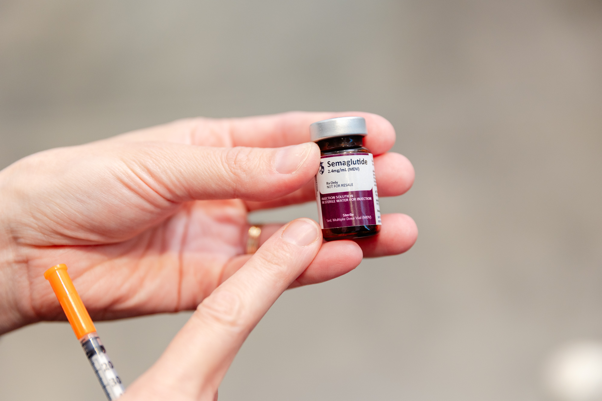 Close up of a medical provider at Tri-County Longevity Center holding a vial of semaglutide near Macomb, MI.